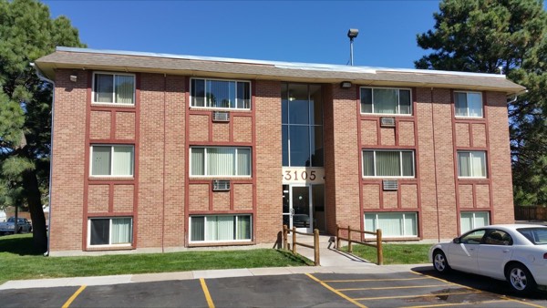 Front entrance at 3105 East Dale Street with brick facade and parking